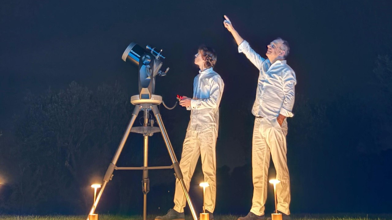 Father and son observing the night sky